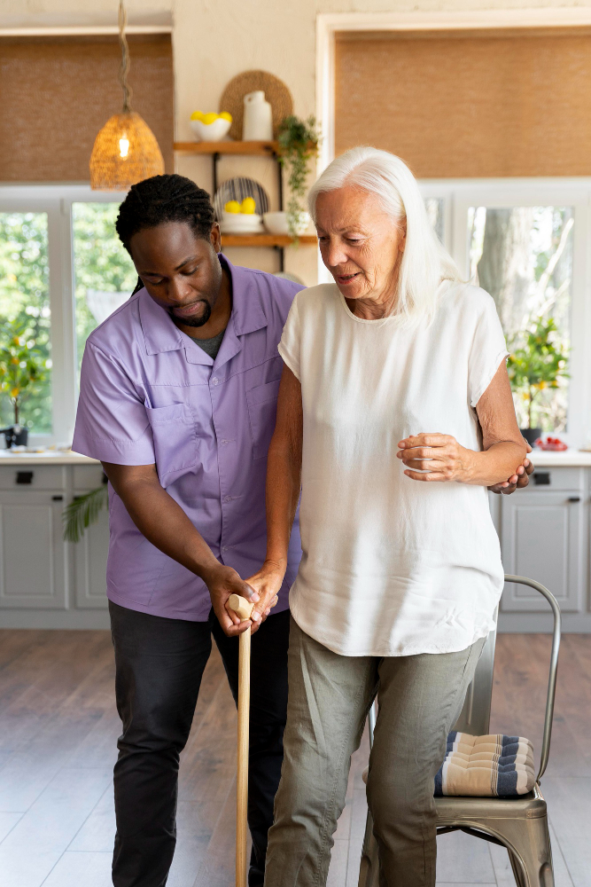 Family and support worker touring a residential aged care facility together