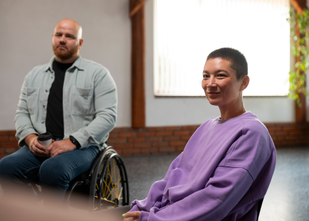 Older adult engaged in a purposeful, uplifting coaching conversation with a support worker