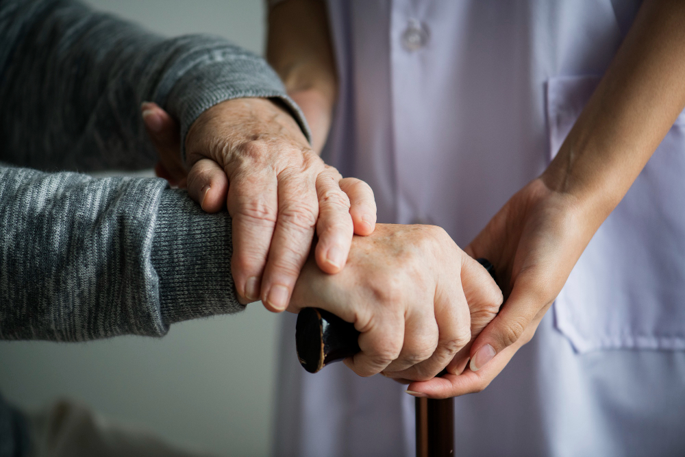 Support worker in a trusted, safe conversation about elder wellbeing and safety