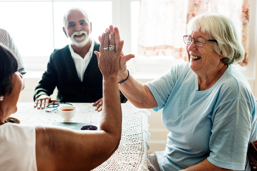 A compassionate support worker with a participant in a warm home environment